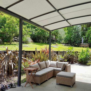 Outdoor seating area under pergola awning